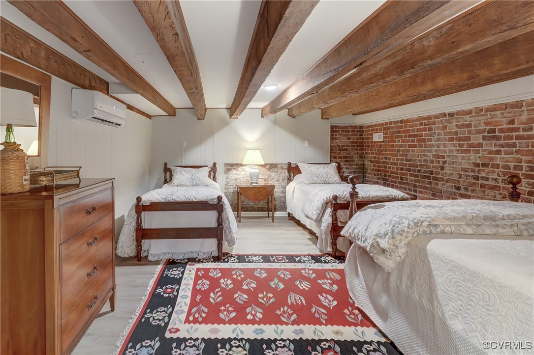 23390 Mt Cloud Road Bowling Green, VA 22427 - Photo 31 of 50 a bed sitting in a room next to a larger window