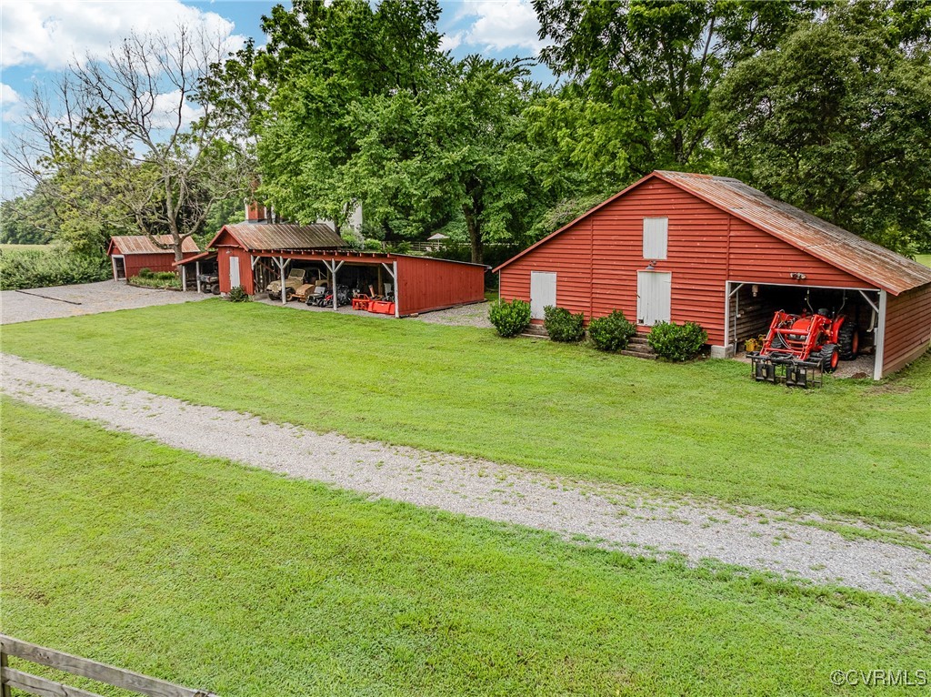 23390 Mt Cloud Road Bowling Green, VA 22427 - Photo 35 of 50 a front view of a house with garden
