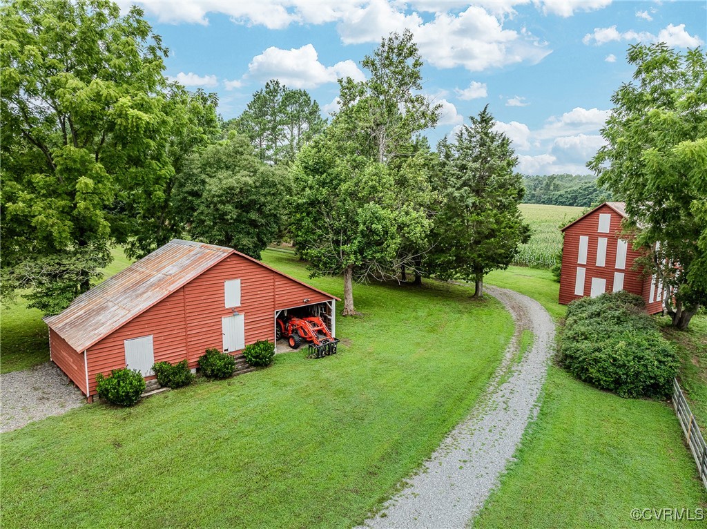23390 Mt Cloud Road Bowling Green, VA 22427 - Photo 36 of 50 a house that is sitting in the grass