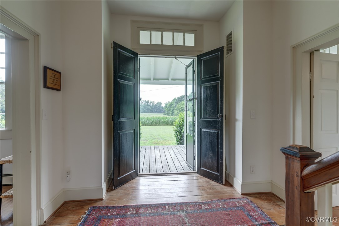 23390 Mt Cloud Road Bowling Green, VA 22427 - Photo 8 of 50 a view of entryway with a front door and wooden floor