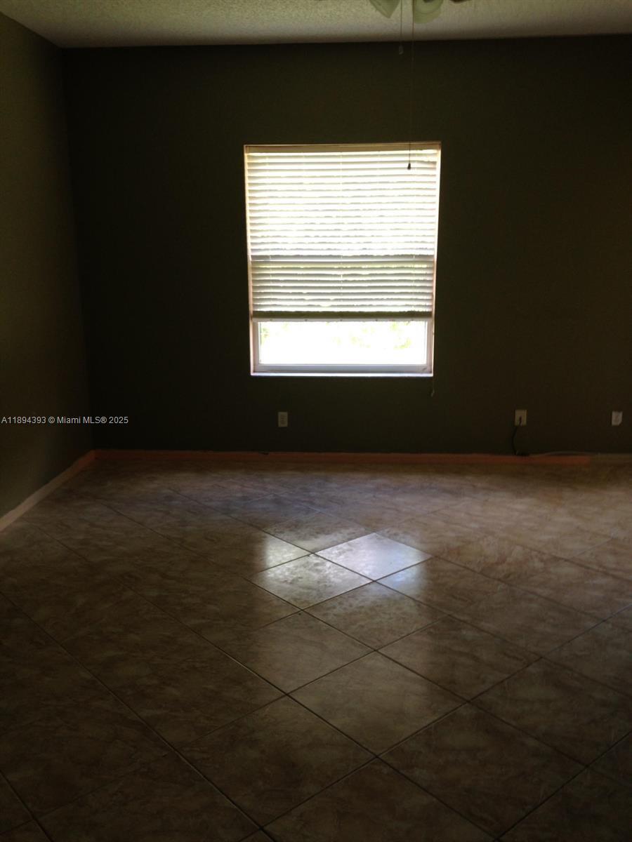 4634 Southwest Eagle Street Port St. Lucie, FL 34953 - Photo 6 of 16 a view of empty room with window