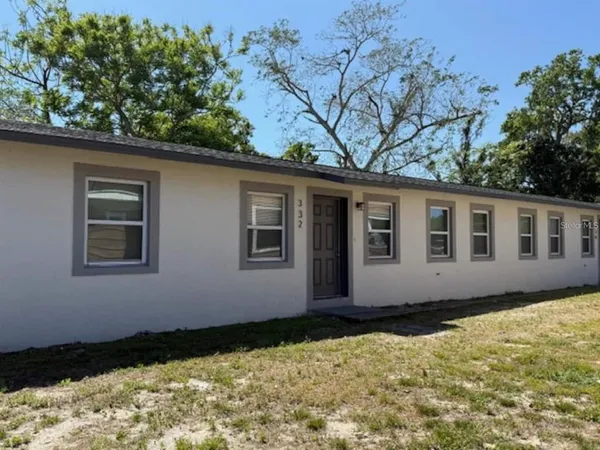 a house with trees in the background