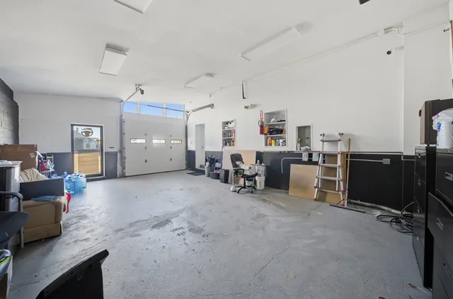 a view of a livingroom with furniture and a flat screen tv