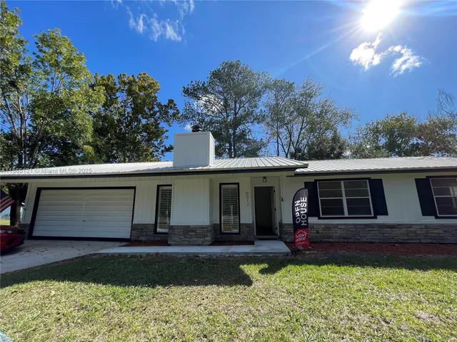 a view of a house with a garden