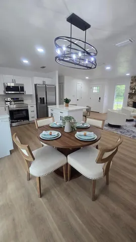 a spacious bedroom with a bed and a window