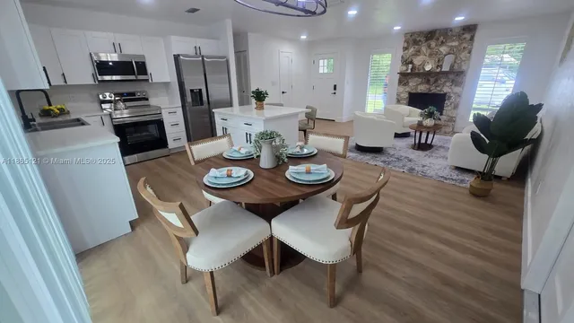 a bathroom with a double vanity sink toilet and shower