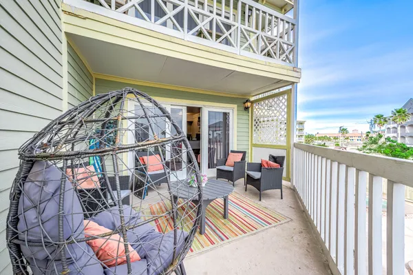 a view of a living room and balcony