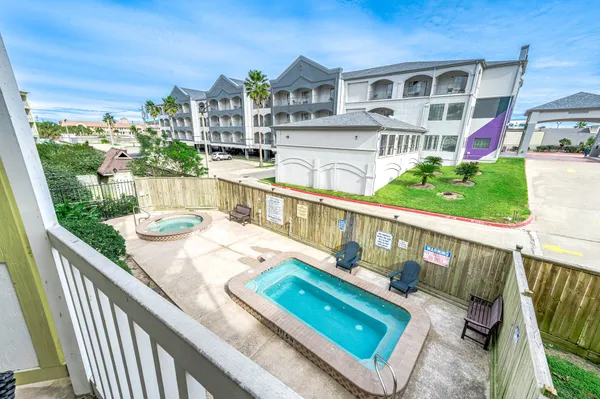a view of a balcony with chairs