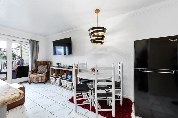 a view of a livingroom with furniture and windows