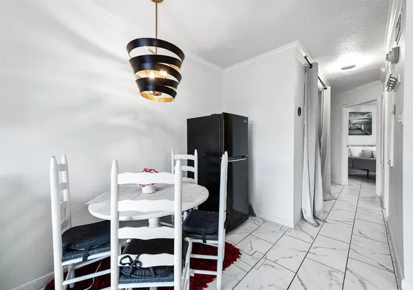 a dining room with furniture and window