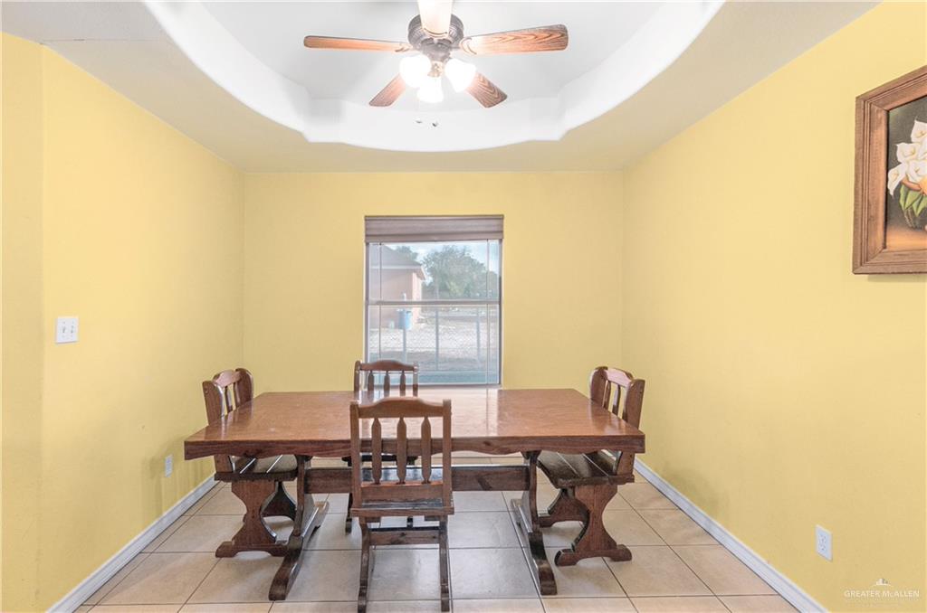 240 East Dicker Road Pharr, TX 78577 - Photo 15 of 23 Recessed tray ceiling with ceiling fan light fixture