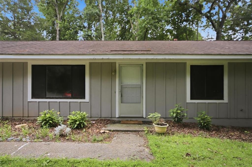 142 Deer Run Canton, GA 30114 - Photo 3 of 24 a view of a house with potted plants and a table and chairs