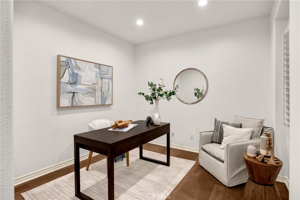 34 Tall Hedge Irvine, CA 92603 - Photo 17 of 75 a living room with furniture a rug and a wall painting