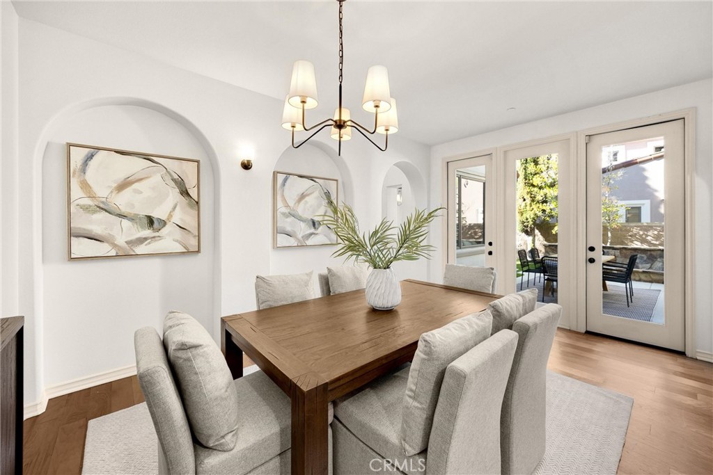 34 Tall Hedge Irvine, CA 92603 - Photo 23 of 75 a view of a dining room with furniture window and wooden floor