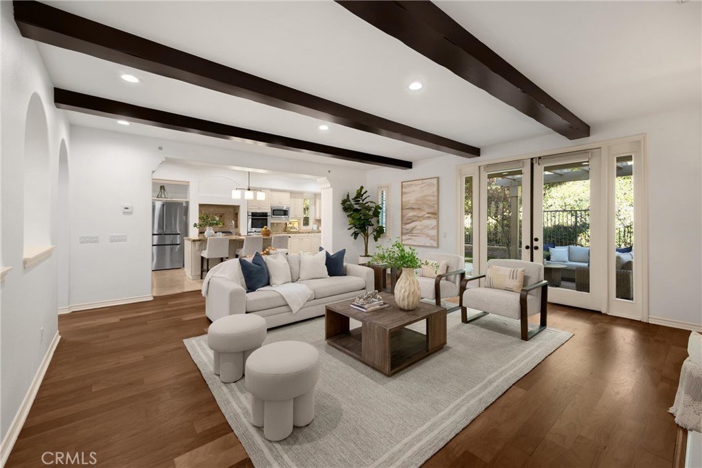 34 Tall Hedge Irvine, CA 92603 - Photo 28 of 75 a living room with furniture wooden floor and a large window