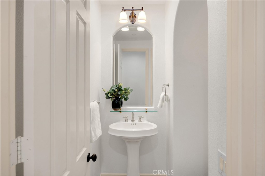 34 Tall Hedge Irvine, CA 92603 - Photo 43 of 75 a bathroom with a sink and a mirror