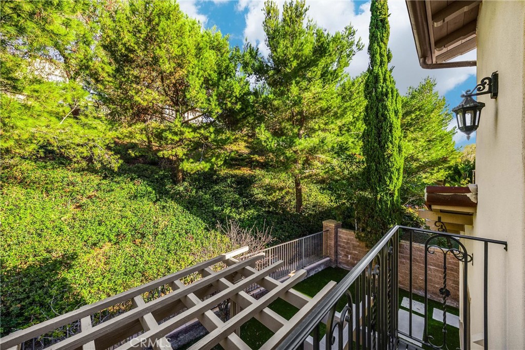 34 Tall Hedge Irvine, CA 92603 - Photo 57 of 75 a view of balcony with wooden floor and fence