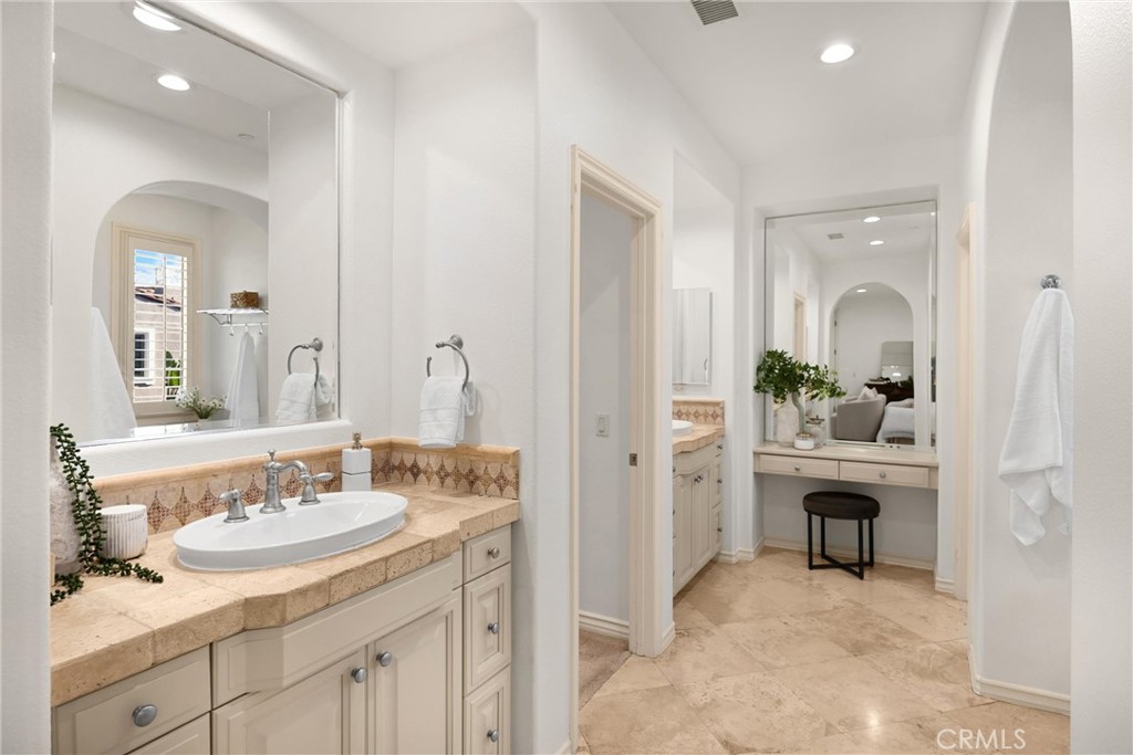 34 Tall Hedge Irvine, CA 92603 - Photo 59 of 75 a en suite bathroom with a sink double vanity and a mirror