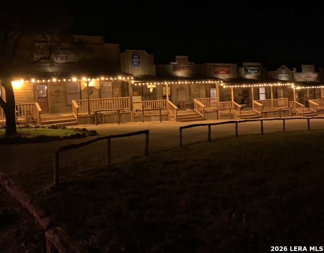 a view of a car park in front of a house