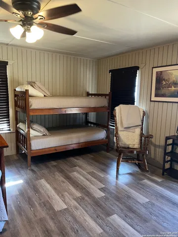 a living room with furniture and a chair