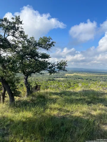 a view of lake with green space