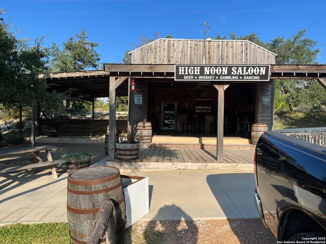 a view of a house with sitting area and garden