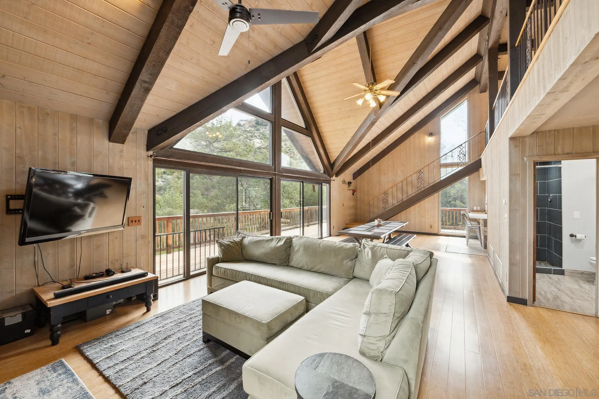 29026 Deer Creek Trail Pine Valley, CA 91962 - Photo 11 of 37 a living room with furniture tv and a large window