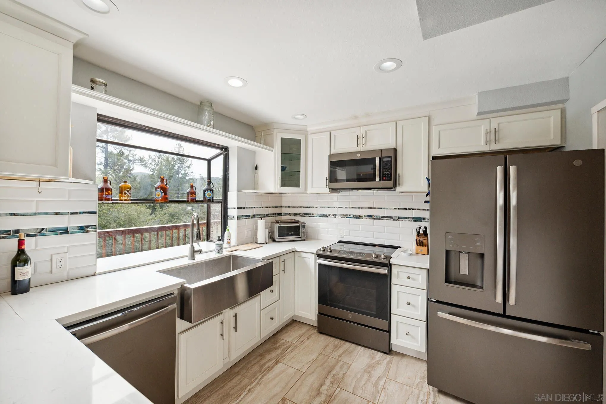 29026 Deer Creek Trail Pine Valley, CA 91962 - Photo 25 of 37 a kitchen with a stove a sink and a refrigerator