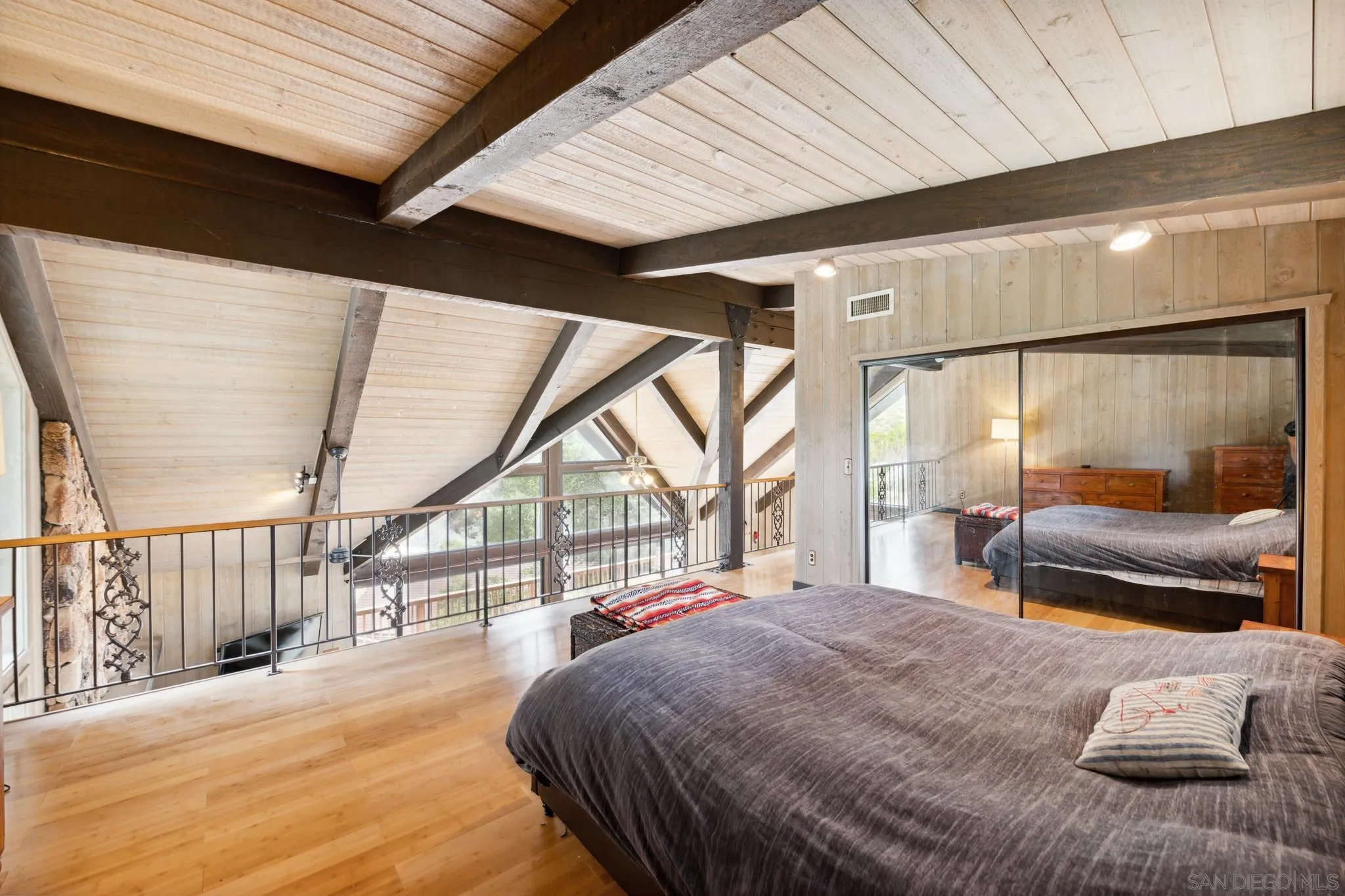 29026 Deer Creek Trail Pine Valley, CA 91962 - Photo 28 of 37 a bedroom with a large bed and a large window