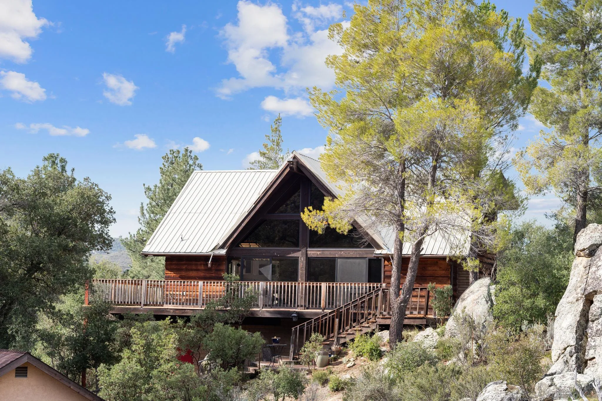 29026 Deer Creek Trail Pine Valley, CA 91962 - Photo 4 of 37 a view of house with wooden fence and trees