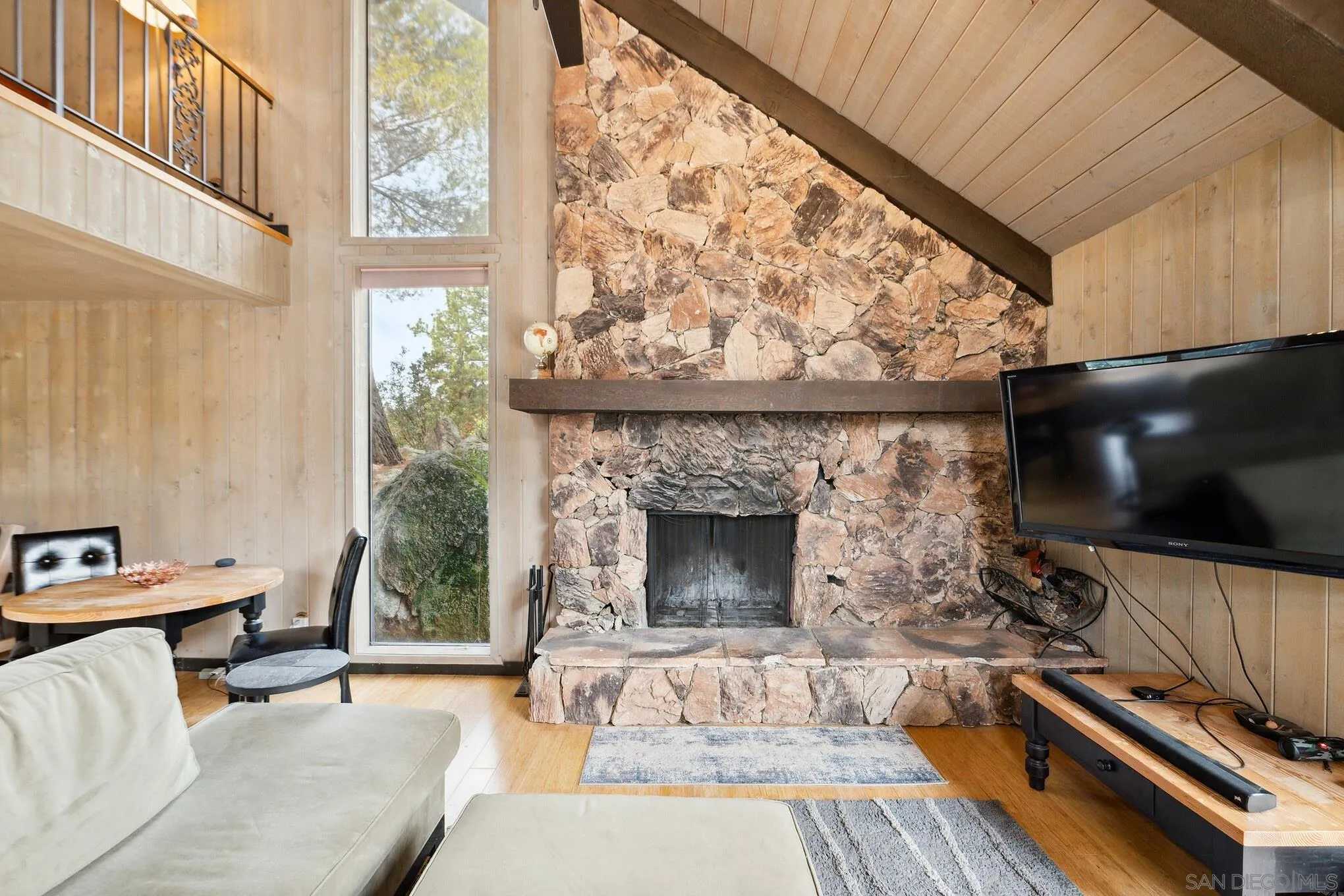 29026 Deer Creek Trail Pine Valley, CA 91962 - Photo 9 of 37 a living room with furniture a flat screen tv and a fireplace