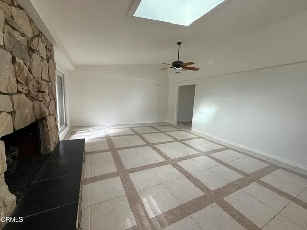 a view of an empty room and window
