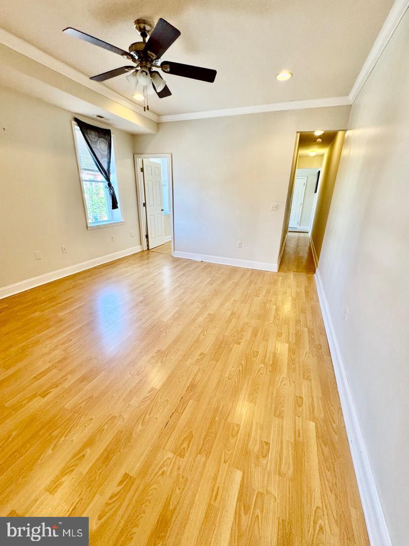 445 East Fort Avenue, Unit A Baltimore, MD 21230 - Photo 8 of 18 a view of an empty room with wooden floor