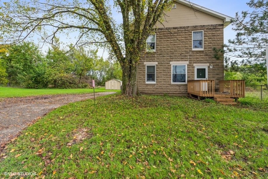 14-n043 Reinking Road Hampshire, IL 60140 - Photo 1 of 12 a view of a house with backyard and a tree