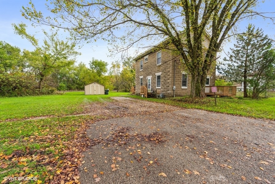 14-n043 Reinking Road Hampshire, IL 60140 - Photo 2 of 12 a view of a yard with plants and large trees