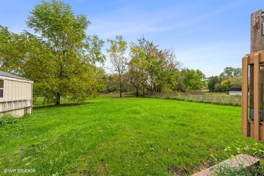 14-n043 Reinking Road Hampshire, IL 60140 - Photo 12 of 12 a view of a yard with a tree