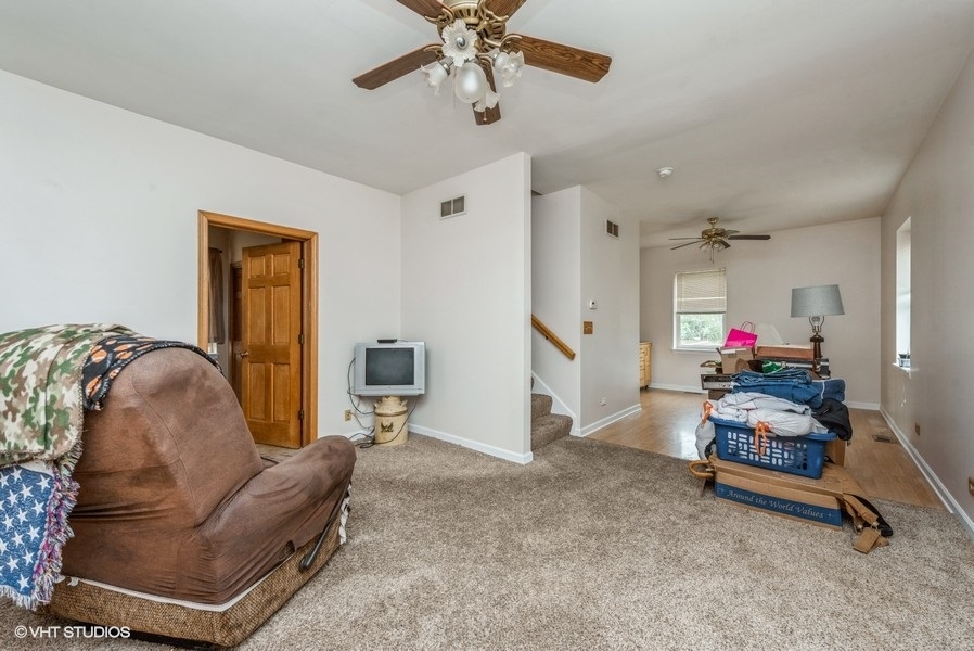 14-n043 Reinking Road Hampshire, IL 60140 - Photo 3 of 12 a living room with furniture gym equipment and a rug