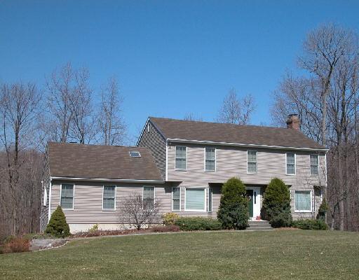 14 Willow Court Ridgefield, CT 06877 - Photo 1 of 1 a front view of a house with garden