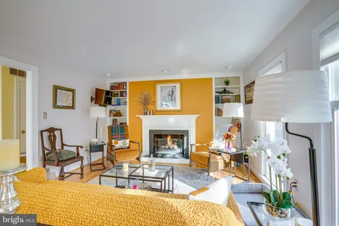 a living room with furniture fireplace and a fireplace
