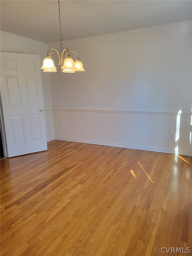 862 Watch Hill Road Midlothian, VA 23114 - Photo 19 of 30 a view of empty room with wooden floor and chandelier