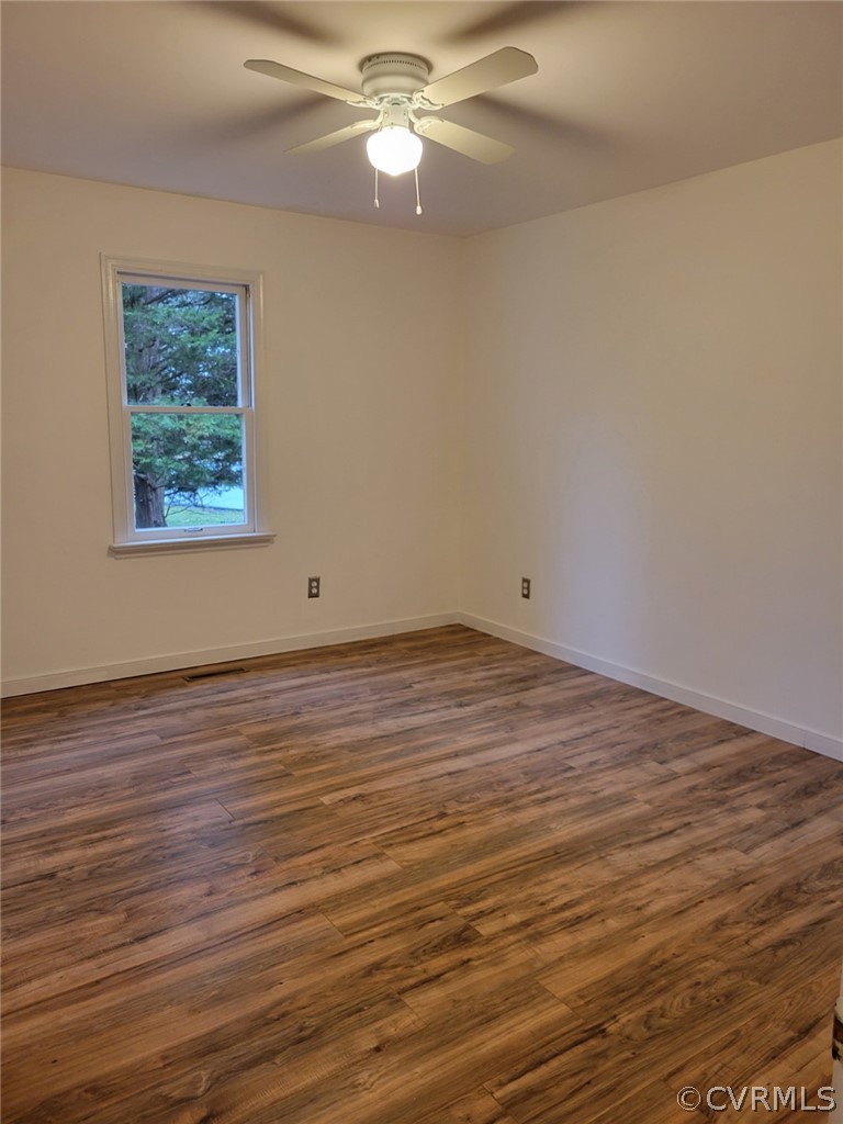 862 Watch Hill Road Midlothian, VA 23114 - Photo 24 of 30 a view of a room with wooden floor and a ceiling fan