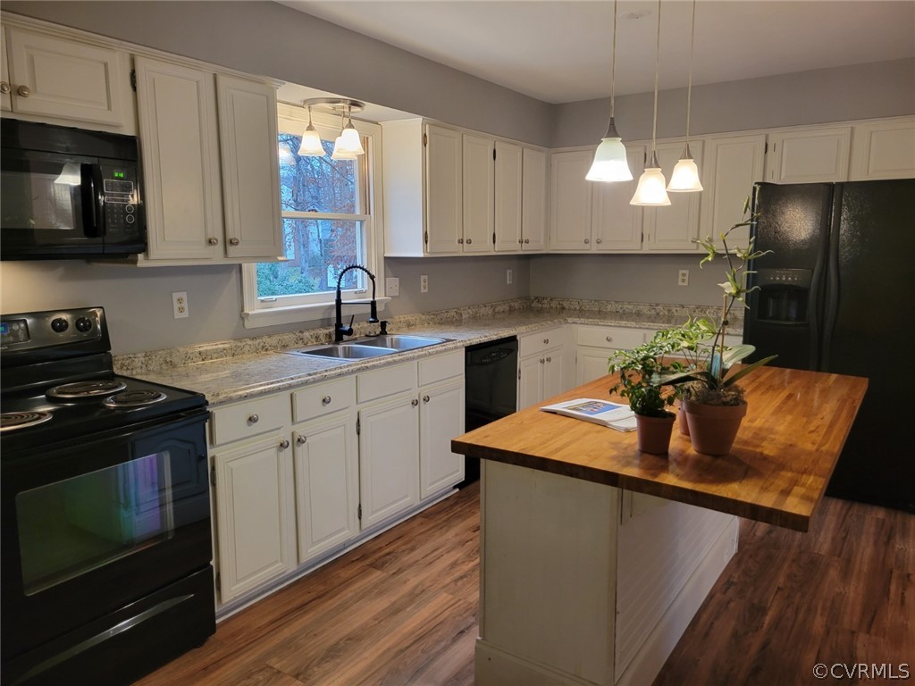 862 Watch Hill Road Midlothian, VA 23114 - Photo 5 of 30 a kitchen with stainless steel appliances granite countertop a sink a stove a microwave a refrigerator and cabinets