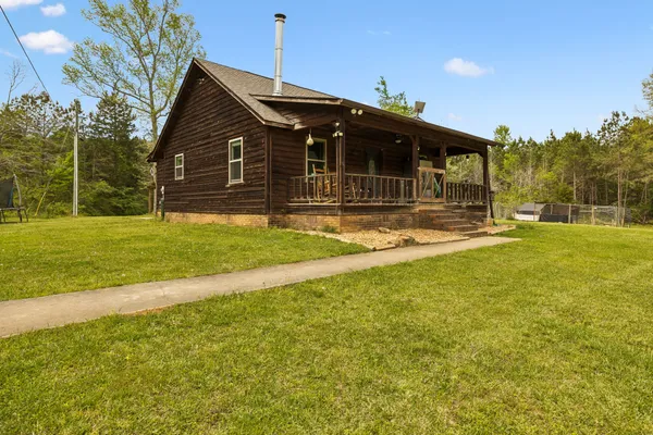 a front view of house with patio and garden
