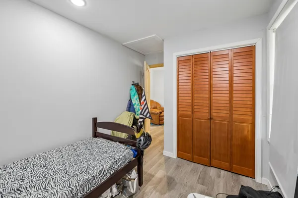 a view of walk in closet with clothes