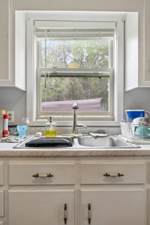 a kitchen with stainless steel appliances a refrigerator stove and sink
