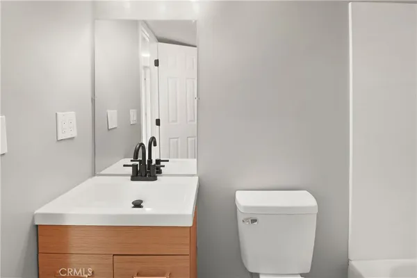 a bathroom with a sink and a toilet