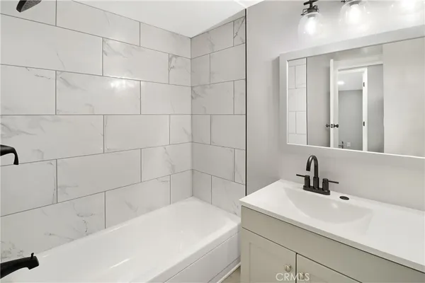 a bathroom with a sink and a bathtub