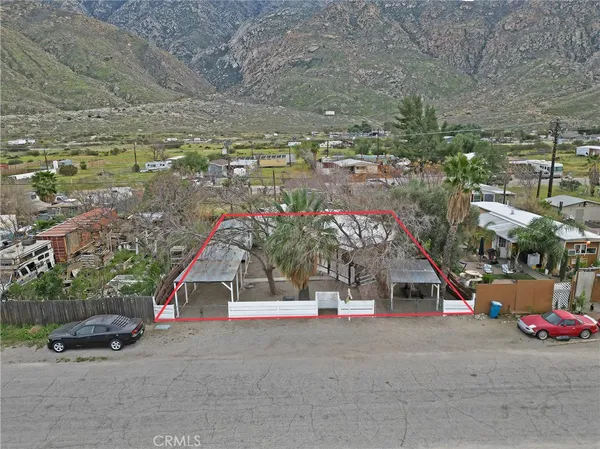 a house with a yard and parking space