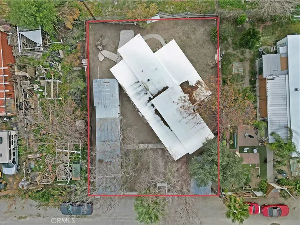 an aerial view of houses with outdoor space
