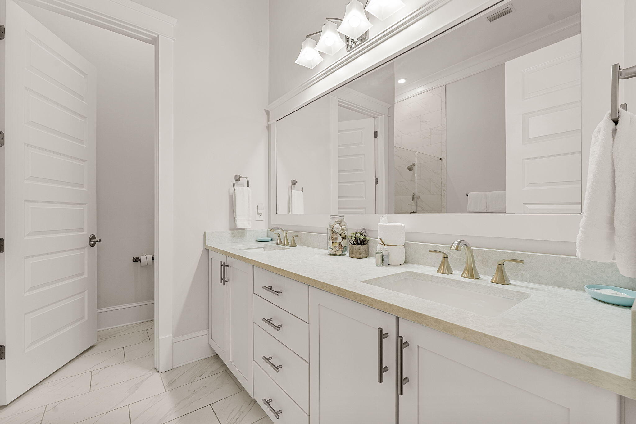 113 Siasconset Ln Inlet Beach Inlet Beach, FL 32461 - Photo 19 of 56 a bathroom with a double vanity sink a mirror and a shower